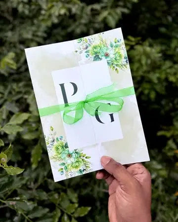 Printed card tied with a green ribbon