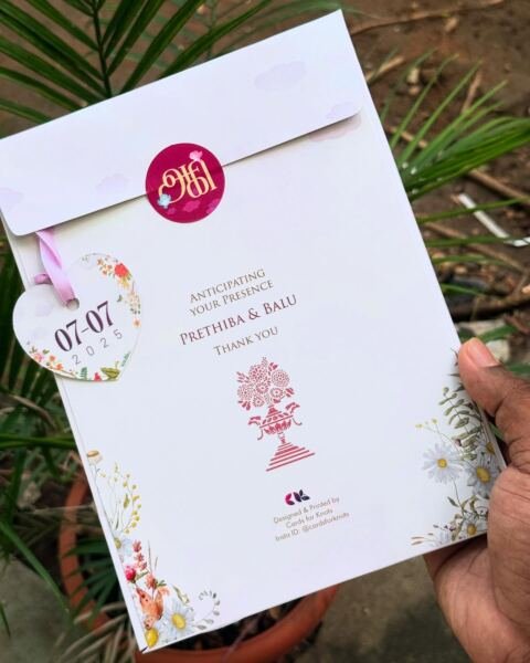 White card with pink seal